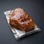 Papada Iberico Melquiades – začinjeni svinjski podbradak u vakuumskom pakiranju.